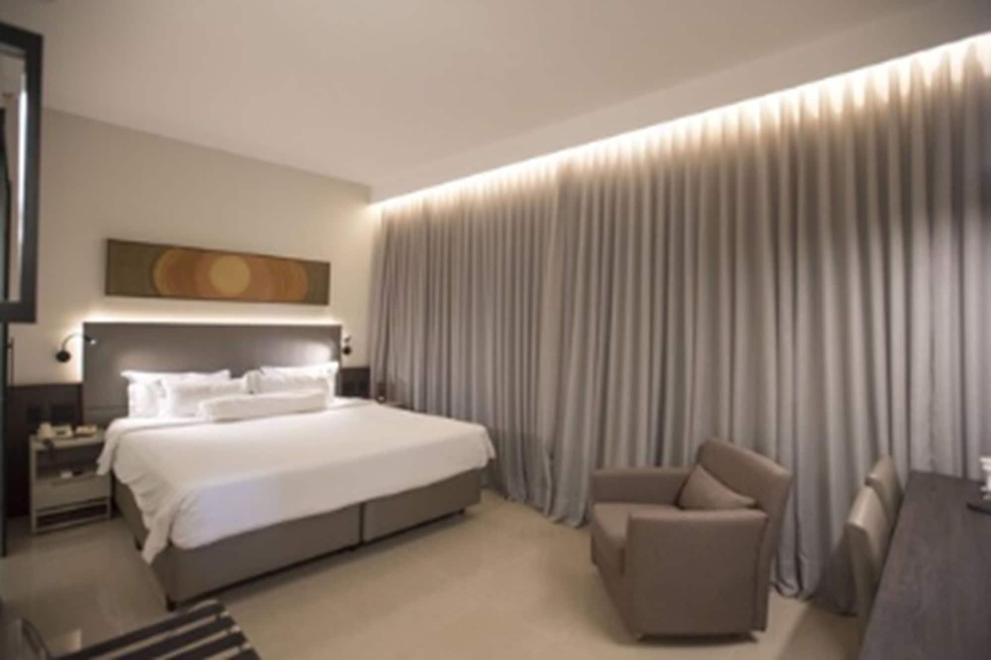 Royal Boutique Savassi Hotel Belo Horizonte Exterior foto A bedroom at the hotel