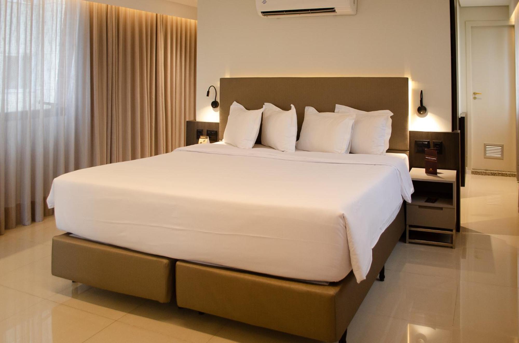 Royal Boutique Savassi Hotel Belo Horizonte Exterior foto A king bed